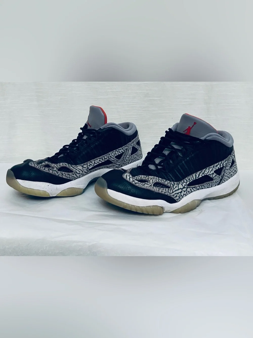 Air Jordan 11 Retro Low IE‎ Men's Black/Grey Sneakers with Red Jumpman Accents
